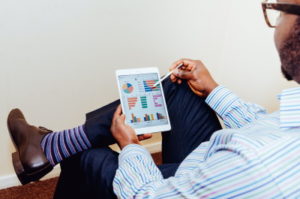 Business man looking at how much the family business has grown over the last six months